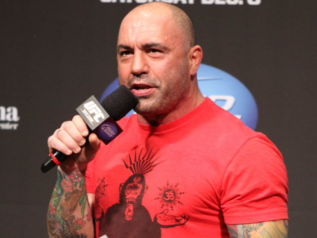 UFC announcer Joe Rogan is seen at the weigh in before a UFC on FOX 5 event in Seattle, Friday, Dec. 7, 2012. (AP Photo/Gregory Payan)