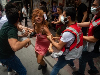 Protesters are detained by police in central Istanbul, on June 26, 2021, as hundreds of LGTBI activists defied a ban and tried to stage a gay pride event. (Photo by Bulent KILIC / AFP) (Photo by BULENT KILIC/AFP via Getty Images)