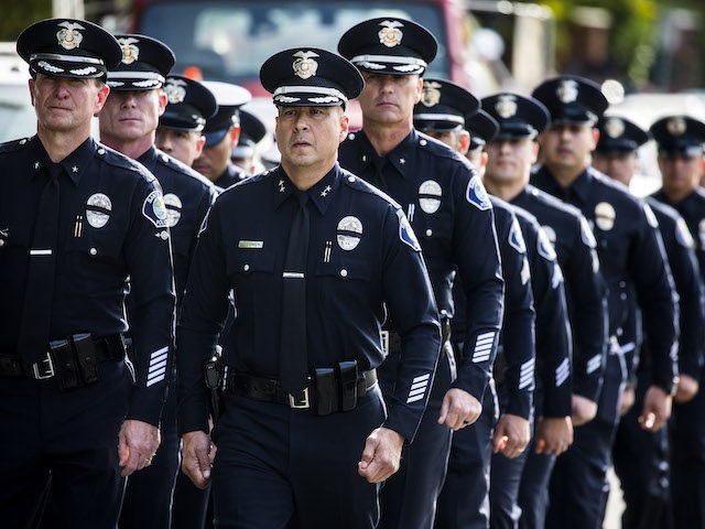 WESTLAKE VILLAGE, CA - NOVEMBER 15: Santa Ana Police Officers leave the service of Sgt. Ron Helus, who was killed Wednesday, Nov. 7, 2018, in a deadly shooting at a country music bar, the Borderline Bar and Grill in Thousand Oaks, Calif., following his memorial service at The Calvary Community …