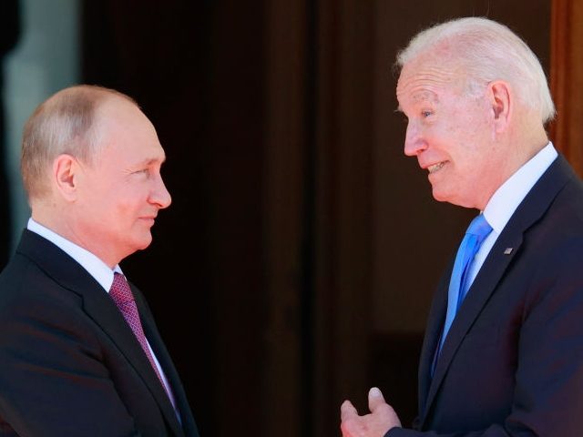 Russian President Vladimir Putin (L) shakes hands with US President Joe Biden prior to their meeting at the 'Villa la Grange' in Geneva on June 16, 2021. (Photo by DENIS BALIBOUSE / POOL / AFP) (Photo by DENIS BALIBOUSE/POOL/AFP via Getty Images)