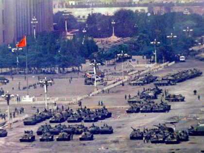 FILE - In this June 5, 1989 file photo, Chinese troops and tanks gather in Beijing, one day after the military crackdown that ended a seven week pro-democracy demonstration on Tiananmen Square. Hundreds were killed in the early morning hours of June 4. Over seven weeks in 1989, the student-led …