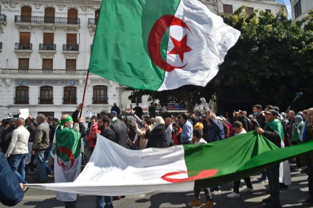 Algerians march during a demonstration in the capital on March 19, 2021