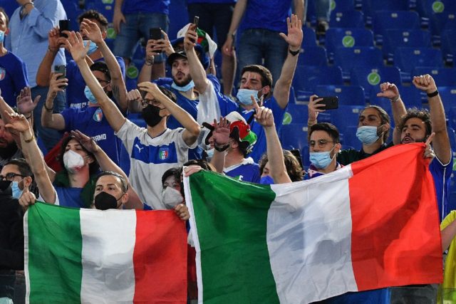 Italy supporters celebrate after their team beat Turkey 3-0 in Rome in the opening game of