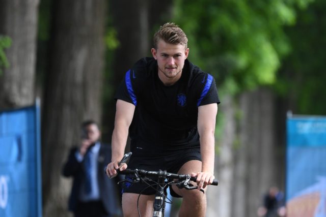 Matthijs de Ligt riding a bike at the Netherlands team training camp in Zeist on Saturday