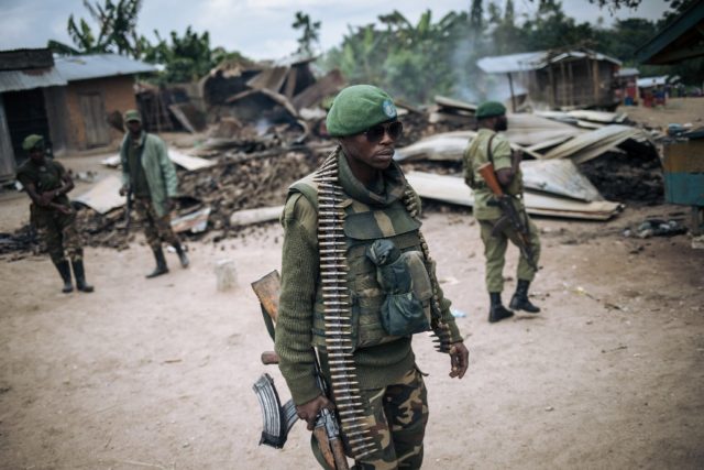 A DR Congo soldier takes part in a foot patrol in a village in February 2020, following an