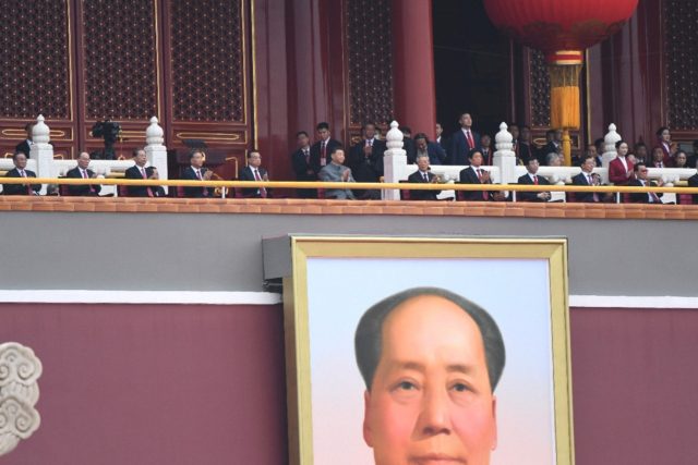 Chinese President Xi Jinping (C) attends the celebration of the 100th anniversary of the f