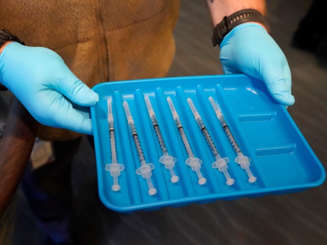 In this Jan. 6, 2021, file photo, syringes containing the COVID-19 vaccine are displayed in Pompano Beach, Fla. The nation’s biggest immunization rollout in history is facing pushback from an unlikely source: health care workers who witnessed COVID-19′s devastation firsthand but are refusing shots in surprising numbers. (AP Photo/Wilfredo Lee, …