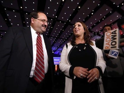 Republican National Committee Chairwoman Ronna Romney McDaniel speaks to reporters as Republican Party of Iowa Chairman Jeff Kaufmann, left, looks on before the Republican Party of Iowa's annual Reagan Dinner, Wednesday, Nov. 8, 2017, in Des Moines, Iowa. (AP Photo/Charlie Neibergall)