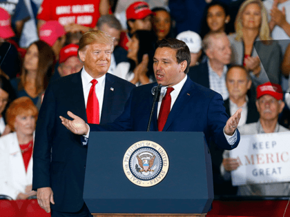President Donald Trump stands behind Ron DeSantis, Candidate for Governor of Florida, as h