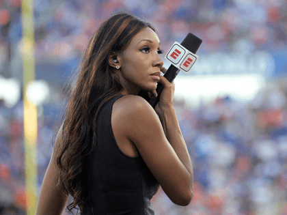 ESPN's Maria Taylor works from the sideline during the first half of an NCAA college football game between Miami and Florida Saturday, Aug. 24, 2019, in Orlando, Fla. (AP Photo/Phelan M. Ebenhack)