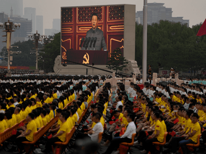 A screen shows Chinese President Xi Jinping speak during a ceremony to mark the 100th anni