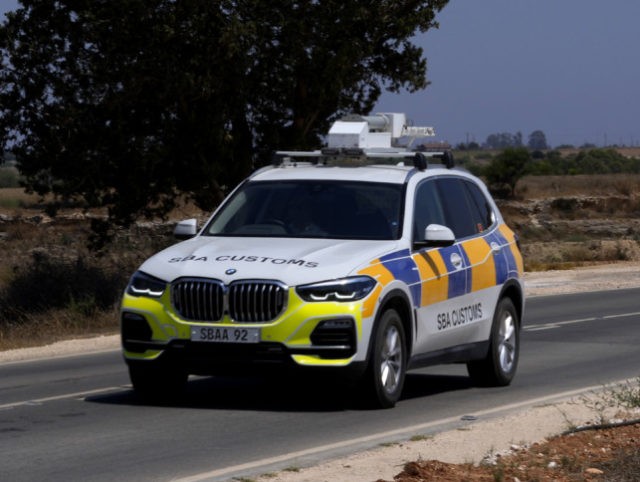 A police customs vehicle travels in the British military base, between Greek Cypriot, sout