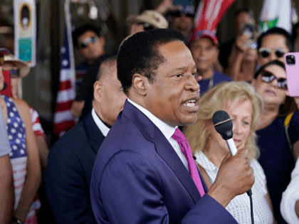 In this July 13, 2021, file photo, conservative radio talk show host Larry Elder speaks to supporters during a campaign stop in Norwalk, Calif. Elder was not on the list of candidates released Saturday in the recall election that could end the term of California Gov. Gavin Newsom. (AP Photo/Marcio …