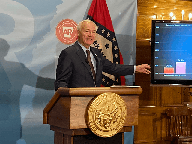 Arkansas Gov. Asa Hutchinson stands next to a chart displaying COVID-19 hospitalization data as he speaks at a news conference at the state Capitol in Little Rock, Ark., Thursday, July 29, 2021. Hutchinson announced he was calling a special session to take up a proposal to lift the stateâ€™s ban …