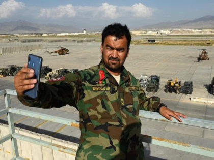 An Afghan National Army (ANA) soldier take a selfie on Monday inside the Bagram US air bas
