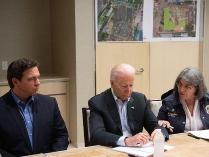 US President Joe Biden speaks alongside Miami Dade County Mayor Daniella Levine Cava (R) and Florida Governor Ron DeSantis (L) about the collapse of the 12-story Champlain Towers South condo building in Surfside, during a briefing in Miami Beach, Florida, July 1, 2021. - President Joe Biden flew to Florida …