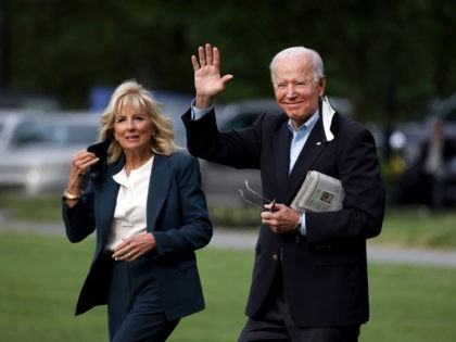 WASHINGTON, DC - JUNE 09: U.S. President Joe Biden waves as he and First Lady Jill Biden walk on the ellipse to board Marine One on June 09, 2021 in Washington, DC. President Joe Biden and the First Lady are traveling to the United Kingdom for the G7 Summit and …