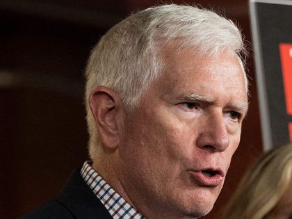 US Congressman Mo Brooks (C), R-AL, speaks with US Congresswoman Marjorie Taylor Greene(R-GA) as they hold a press conference to call for the dismissal of Dr. Anthony Fauci on Capitol Hill in Washington, DC, on June 15, 2021. (Photo by JIM WATSON / AFP) (Photo by JIM WATSON/AFP via Getty …