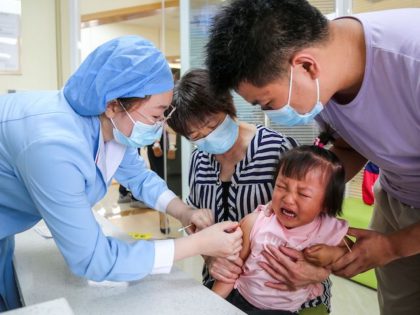 This photo taken on June 1, 2020 shows a child receiving a pneumococcal conjugate vaccine at a community healthcare centre in Zhengzhou in China's central Henan province. (Photo by STR / AFP) / China OUT (Photo by STR/AFP via Getty Images)