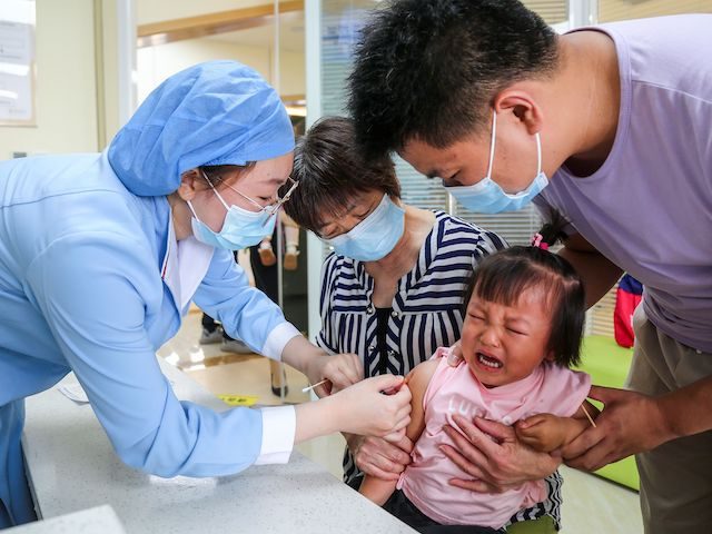 This photo taken on June 1, 2020 shows a child receiving a pneumococcal conjugate vaccine