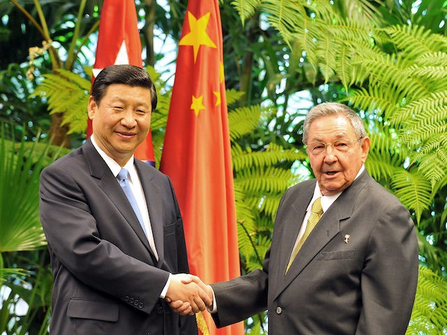 China's Vice-President Xi Jinping (L) shakes hands with Cuban President Raul Castro (R), on June 5, 2011 at Revolution Palace in Havana. Xi is in Cuba on a four-day official visit as part of an international tour that will include stops in Italy and Uruguay. China, Cuba's second largest trading …