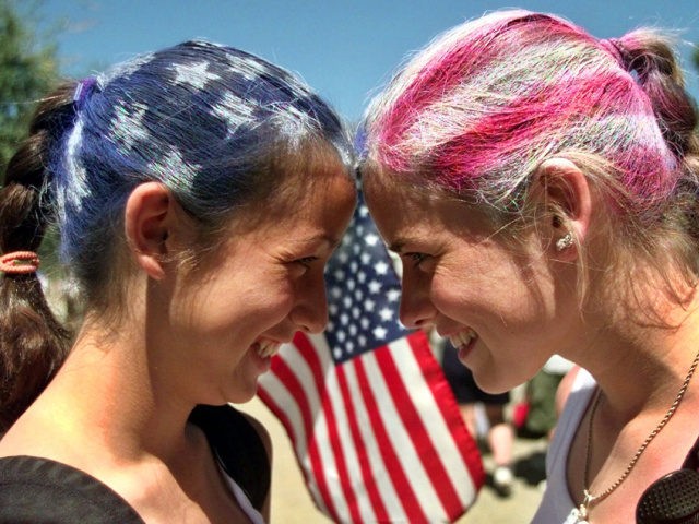 Erica Cook, left, 14, and her sister Jessica Cook, 19, of Burlingame, Calif., use their pa