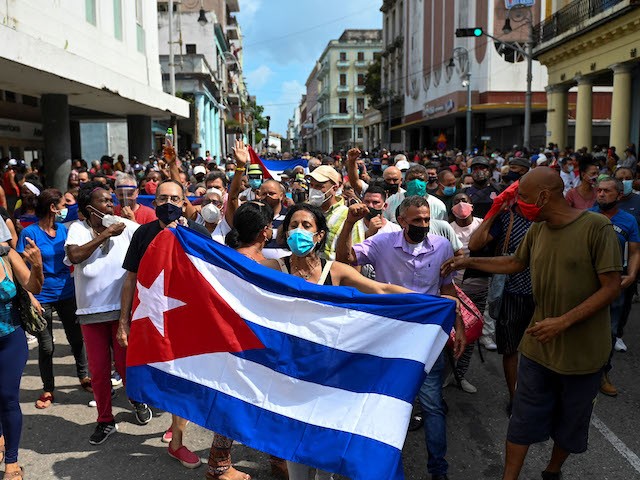 TOPSHOT - People take part in a demonstration to support the government of the Cuban President Miguel Diaz-Canel in Havana, on July 11, 2021. - Thousands of Cubans took part in rare protests Sunday against the communist government, marching through a town chanting "Down with the dictatorship" and "We want liberty." (Photo by YAMIL LAGE / AFP) (Photo by YAMIL LAGE/AFP via Getty Images)