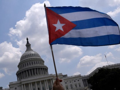 Cuban activists and supporters rally outside the US Capitol in Washington, DC on July 27, 2021. - Human rights groups accuse Cuba's rulers of using censorship and fear tactics to repress historic anti-government demonstrations -- the biggest protests since the revolution that brought Fidel Castro to power in 1959. (Photo …