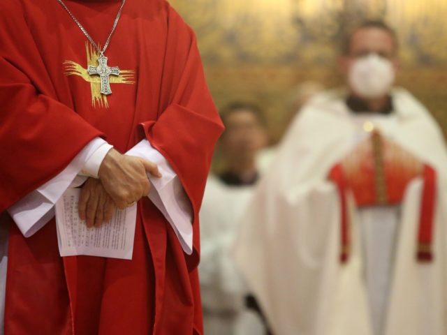 BERLIN, GERMANY - JUNE 29: A bishop listens as Cardinal Secretary of State of the Vatican