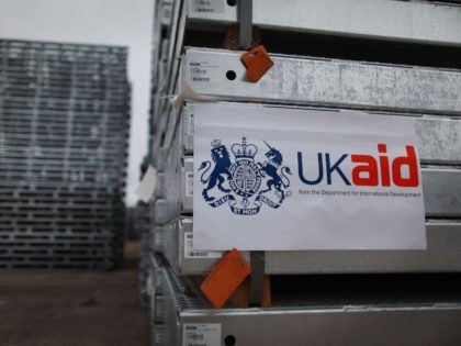 GLOUCESTER, ENGLAND - AUGUST 25: A UK Aid sticker is placed on pre-fabricated bridges as they are loaded into containers for shipping to Pakistan on August 25, 2010 in Gloucester, England. The Department for International Development are sending 10 bridges to Pakistan to help restore infrastructure damaged in recent floods. …