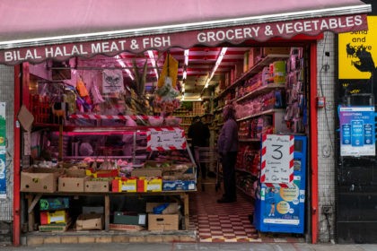 LONDON, ENGLAND - MAY 03: Social distancing signs at a Halal butchers in Lewisham on May 3, 2020 in London, England. The Office For National Statistics (ONS) data analysis released this week on the Coronovirus pandemic found that poor areas of England and Wales are the worst affected. The most …