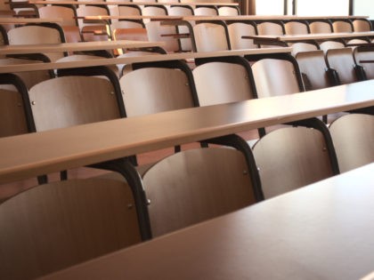Shot of an empty university classroom after the cancellation of schools regarding covid 19