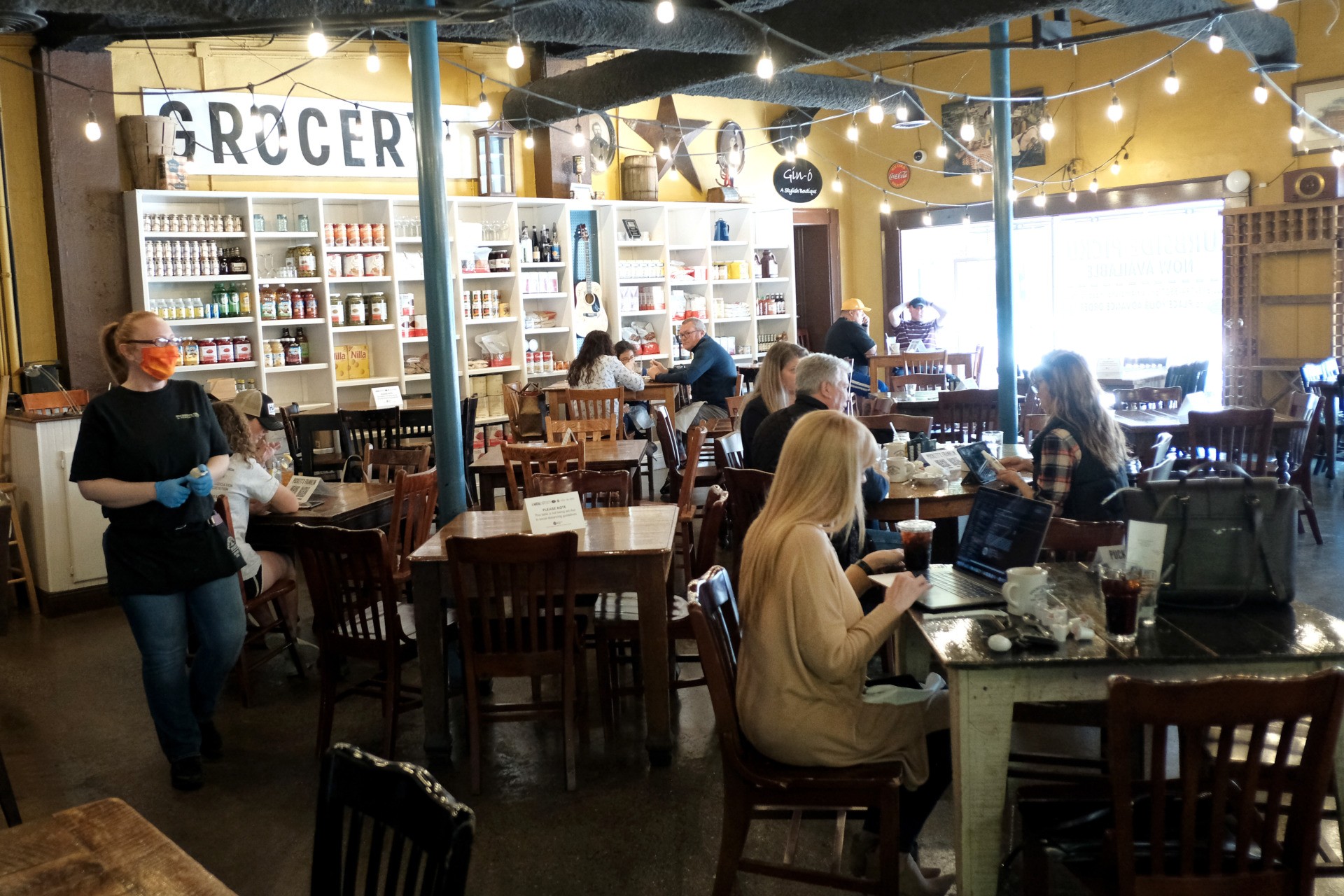 NASHVILLE, TENNESSEE - APRIL 27: Customers are seen at Puckett's Grocery & Restaurant on April 27, 2020 in Franklin, Tennessee. Tennessee is one of the first states to reopen restaurants after the onset of the coronavirus (COVID-19). Restaurants are allowed to open at 50% capacity and maintain social distancing. (Photo by Jason Kempin/Getty Images)