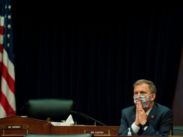 Rep. Sean Casten, D-Ill, listens as US Securities and Exchange Commission Chairman Jay Cla