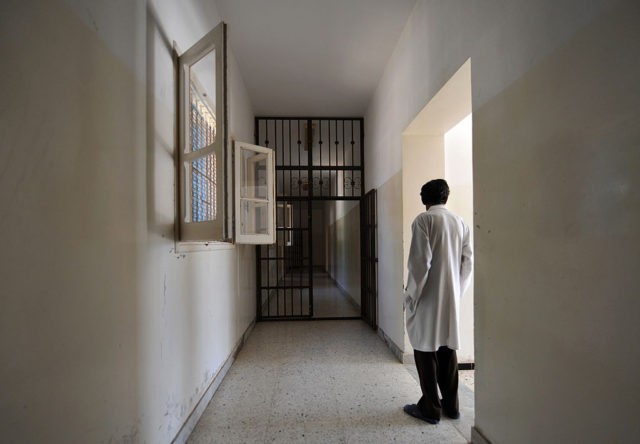 A metal-barred doors stands open in a hall of the Psychiatric hospital in Tripoli, on August 28, 2011. Tripoli's sole psychiatric hospital, already unable to cope under Libyan leader Moamer Kadhafi, is struggling with a flood of new cases brought on by the revolution's battles, as well as a lack …