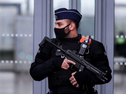 Belgian police officers stand guard at the entrance to Antwerp courthouse, on November 27,