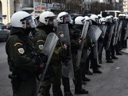 A Greek student confronts Greek riot police during a protest by students against both the ministry of Education and the police who plan to create a dedicated 1,000-strong force to patrol campuses, in Thessaloniki, northern Greece on January 21, 2021. - The operation of Greek universities has been disrupted for …