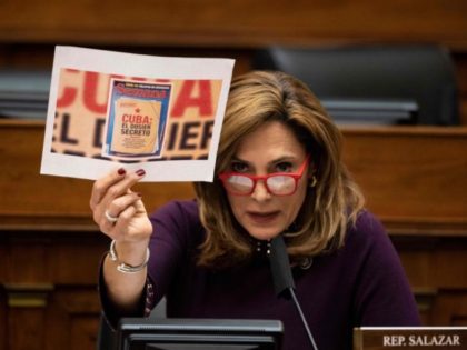 Representative Maria Salazar, a Republican from Florida, holds a sign during testimony by US Secretary of State Antony Blinken before the House Committee on Foreign Affairs on "The Biden Administration's Priorities for US Foreign Policy" on Capitol Hill, March 10, 2021 in Washington, DC. (Photo by Ting Shen / POOL …