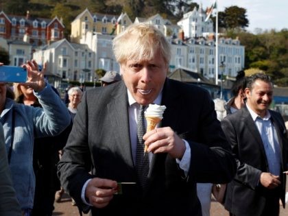 LLANDUDNO, WALES - APRIL 26: Britain's Prime Minister, Boris Johnson eats an ice-cream as