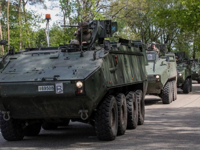 A military convoy drives through Kempen National Park in Maasmechelen near Maastricht on M