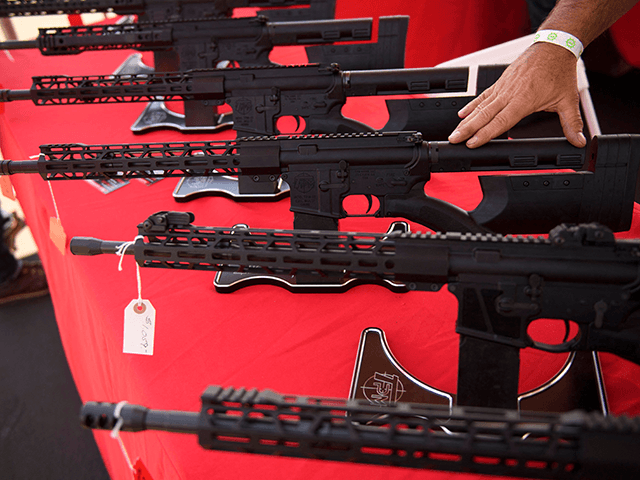 A TPM Arms LLC California-legal featureless AR-15 style rifle is displayed for sale at the company's booth at the Crossroads of the West Gun Show at the Orange County Fairgrounds on June 5, 2021 in Costa Mesa, California. - Gun sales increased in the US following Covid-19 pandemic lockdowns. On …