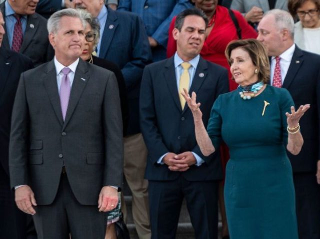 US Speaker of the House Nancy Pelosi (D-CA) (R) speaks with US Representative Kevin McCarthy (R-CA) (L) before a moment of silence by congressional leaders to honor the 600,000 American lives lost to Covid-19 at the US Capitol in Washington, DC on June 14, 2021. (Photo by ANDREW CABALLERO-REYNOLDS / …