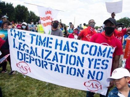 Pro-immigration activists from organizations including CASA and the Center for Popular Democracy, hold a "WeCantWait" march to urge Congress to act on immigration reform, climate change, healthcare and jobs, during a rally on the National Mall in Washington, DC, June 24, 2021. (Photo by SAUL LOEB / AFP) (Photo by …