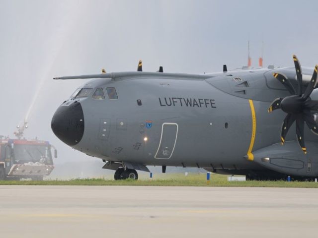 An Airbus A400M cargo plane of the German armed forces Bundeswehr is greeted by water cann