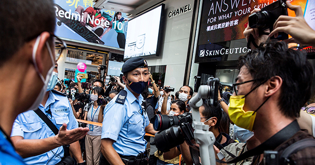 Hong Kong Bans Journalist from Leaving for Filming Police Stabbing - Vimarsana News