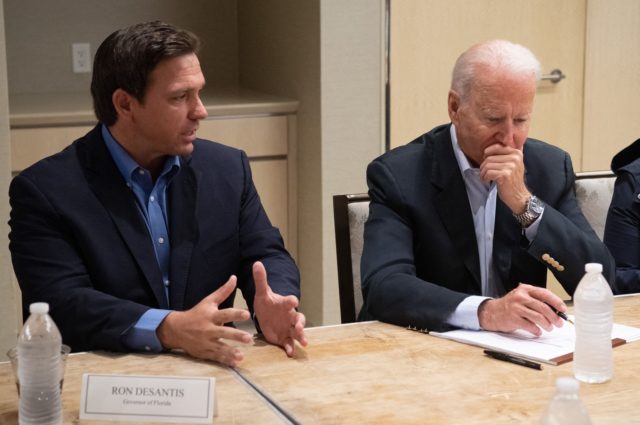 US President Joe Biden alongside Florida Governor Ron DeSantis (L) speaks about the collapse of the 12-story Champlain Towers South condo building in Surfside, during a briefing in Miami Beach, Florida, July 1, 2021. - President Joe Biden flew to Florida on Thursday to "comfort" families of people killed or …