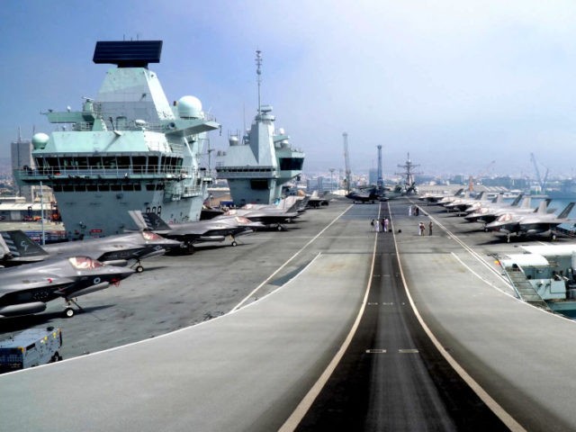 This picture taken on July 1, 2021 shows a view of the take-off ramp of the Royal Navy's HMS Queen Elizabeth aircraft carrier while moored in the new port of Cyprus' southern city of Limassol. - HMS Queen Elizabeth, the largest warship ever built for the Royal Navy, docks at …