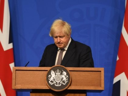 Britain's Prime Minister Boris Johnson gives an update on relaxing restrictions imposed on the country during the coronavirus covid-19 pandemic at a virtual press conference inside the Downing Street Briefing Room in central London on July 5, 2021. - Prime Minister Boris Johnson will on Monday unveil a plan to …