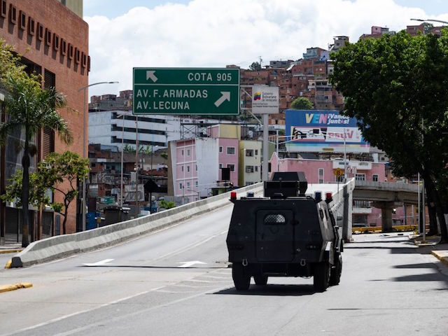 Members of the Special Actions Forces command (FAES) aboard an armored vehicle drive along