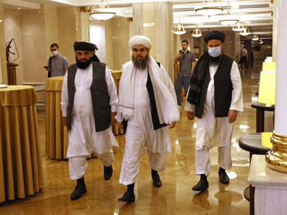 Leaders of the Taliban movement and negotiators Abdul Latif Mansoor (R), Shahabuddin Delawar (C) and Suhail Shaheen (L) walk to attend a press conference in Moscow on July 9, 2021. - Russia on July 9, 2021, said the Taliban controls about two-thirds of the Afghan-Tajik border and urged all sides …